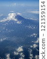 Aerial view of Mount Fuji towering over the clouds 121359154