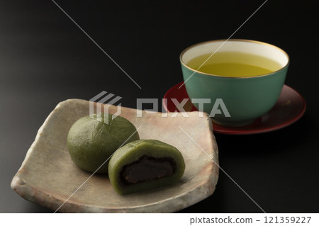 Kusamochi, mugwort mochi, spring flavors, black background Kusamochi, mugwort mochi, spring flavors, black background 121359227