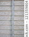 The exterior wall of a house whose ceiling has deteriorated and is cracked 121359804