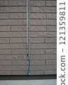 The exterior wall of a house where the sealant had deteriorated and peeled off 121359811
