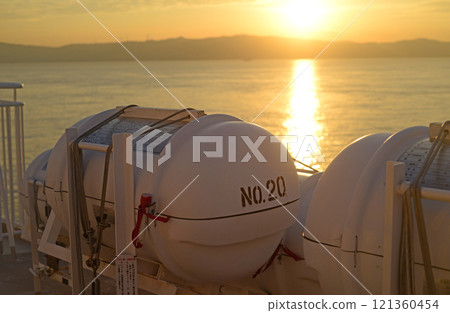 Awaji Island sunrise and ferry boat life raft capsule 121360454