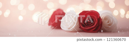 Intertwined Roses in Red and White Surrounded by Soft Light and Blur 121360670