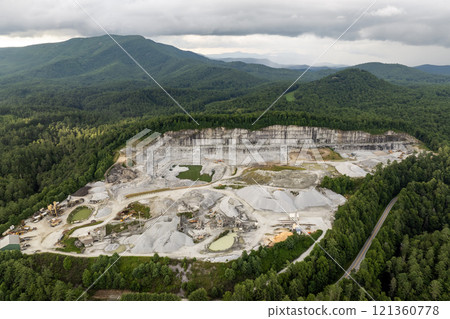 Aerial view of open pit mining site of limestone materials extraction for construction industry 121360778
