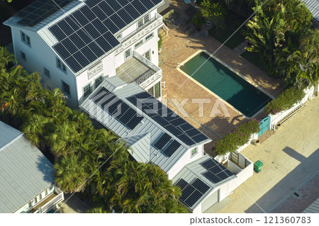 Aerial view of new expensive american home roof with blue solar photovoltaic panels for producing clean ecological electric energy. Renewable electricity with zero emission concept 121360783