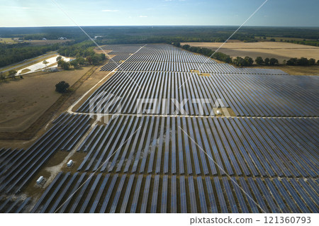 Aerial view of large sustainable electrical power plant with rows of solar photovoltaic panels for producing clean electric energy. Concept of renewable electricity with zero emission 121360793