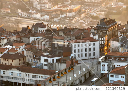 Aerial view of dense historic center of Thiers town in Puy-de-Dome department, Auvergne-Rhone-Alpes region in France. Rooftops of old buildings and narrow streets at sunset Aerial view of dense historic center of Thiers town in Puy-de-Dome department, Auvergne-Rhone-Alpes region in France. Rooftops of old buildings and narrow streets at sunset 121360829