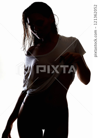 Sexy woman in wet shirt and underwear. Wet Hair Beautiful Girl silhouette 121362052