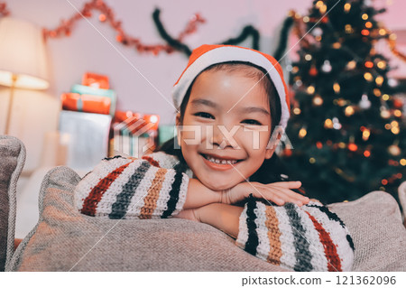 christmas, x-mas, winter, happiness concept - dreaming girl in santa helper hat christmas, x-mas, winter, happiness concept - dreaming girl in santa helper hat 121362096