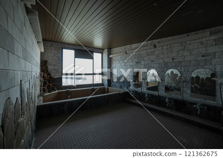 Remains of a large bathhouse at an abandoned inn along the sea 121362675