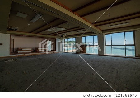 Remains of a large hall in an abandoned seaside inn Remains of a large hall in an abandoned seaside inn 121362679