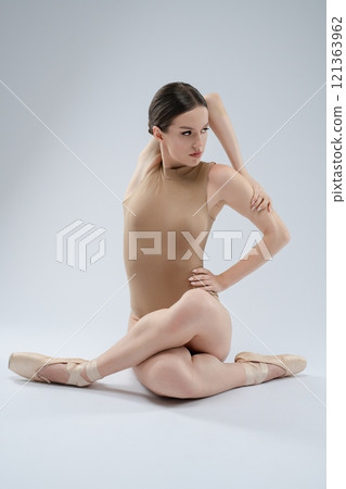 Ballet dancer in graceful pose showcasing flexibility and strength 121363962