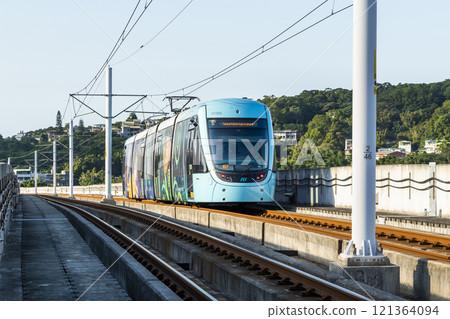 A train traveling on the Danhai Light Rail transit (LRT) in New Taipei City, Taiwan. 121364094
