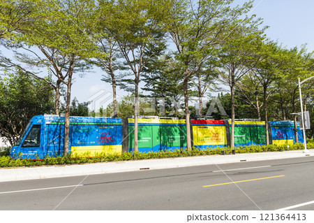 The circular light rail train drives past the Kaohsiung Museum of Fine Arts station in Taiwan. The circular light rail train drives past the Kaohsiung Museum of Fine Arts station in Taiwan. 121364413
