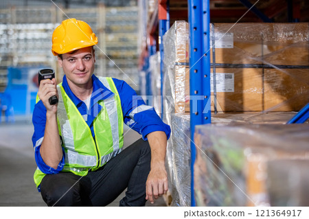 Man professional worker barcode reader scanning box inspect product on shelves in warehouse. Supervisor scanning merchandise checklist package information in storehouse service import export. 121364917