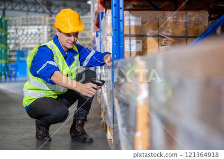 Man professional worker barcode reader scanning box inspect product on shelves in warehouse. Supervisor scanning merchandise checklist package information in storehouse service import export. 121364918