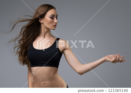 Slim girl in black top and shorts view Slim girl in black top and shorts view 121365140