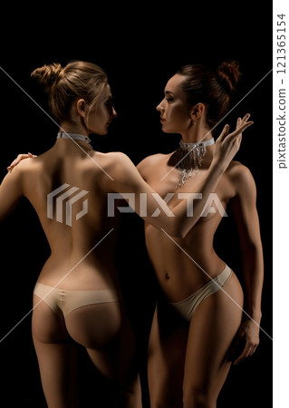 Two beautiful women topless shot Two beautiful women topless shot 121365154