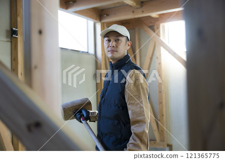 man working at construction site man working at construction site 121365775