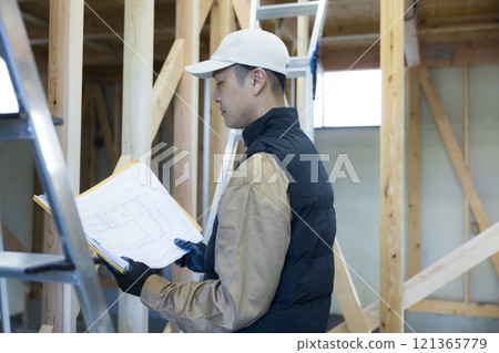 man working at construction site man working at construction site 121365779