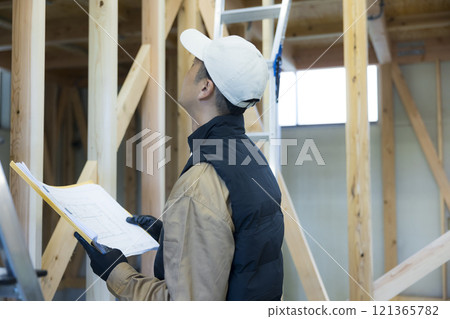 man working at construction site man working at construction site 121365782