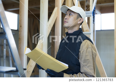 man working at construction site 121365783
