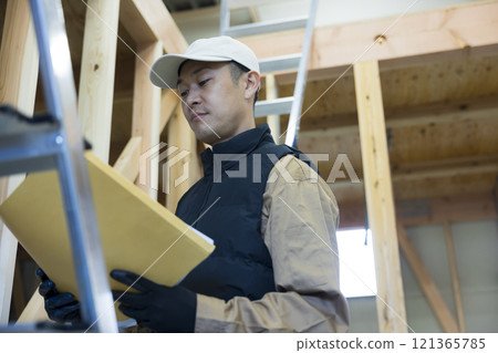 man working at construction site man working at construction site 121365785