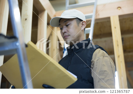 man working at construction site man working at construction site 121365787