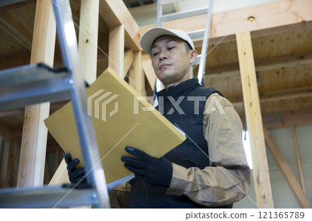 man working at construction site 121365789