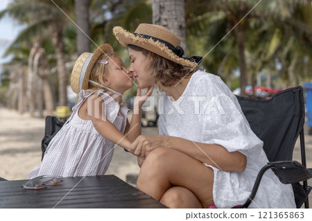 Happy mother hugging and kiss baby daughter family vacation summer. Mother love for her child is bond moment of happy. 121365863