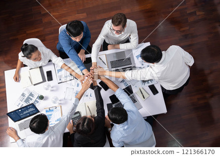 Group of diverse office worker join hand together in office. Prudent Group of diverse office worker join hand together in office. Prudent 121366170