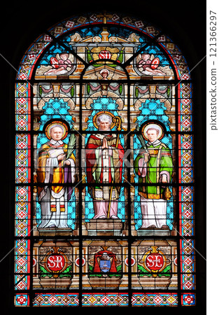 Saint Denis, stained glass windows in the Saint Roch Church, Paris, France Saint Denis, stained glass windows in the Saint Roch Church, Paris, France 121366297