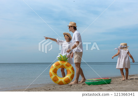 Family happy walking on beach children mother father travel summer vacation together sea holiday tropical. Trip enjoying bonding. Family happy walking on beach children mother father travel summer vacation together sea holiday tropical. Trip enjoying bonding. 121366341
