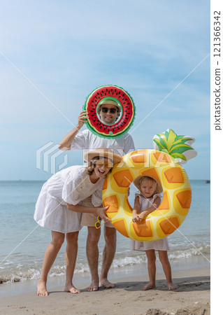 Family happy walking on beach children mother father travel summer vacation together sea holiday tropical. Trip enjoying bonding. Family happy walking on beach children mother father travel summer vacation together sea holiday tropical. Trip enjoying bonding. 121366342