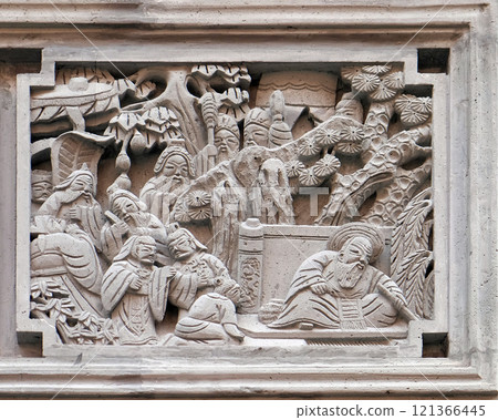 Richly carved stone bass-relief plaque on the doorway of the house in the Grand Canal, ancient town of Yuehe in Jiaxing, Zhejiang Province, China Richly carved stone bass-relief plaque on the doorway of the house in the Grand Canal, ancient town of Yuehe in Jiaxing, Zhejiang Province, China 121366445