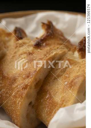 Steaming stale bread in a bamboo steamer 121366574