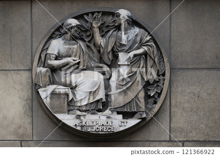 Asclepiade and Lucrece, Greek medicine in Rome. Stone relief at the building of the Faculte de Medicine Paris, France. Asclepiade and Lucrece, Greek medicine in Rome. Stone relief at the building of the Faculte de Medicine Paris, France. 121366922
