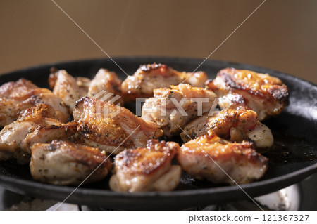 Chicken steak grilled on a hot plate Chicken steak grilled on a hot plate 121367327