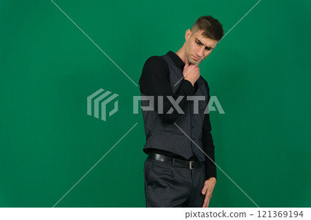 young handsome hicpanic man thinking, feeling doubtful and confused, with different options, wondering which decision to make 121369194