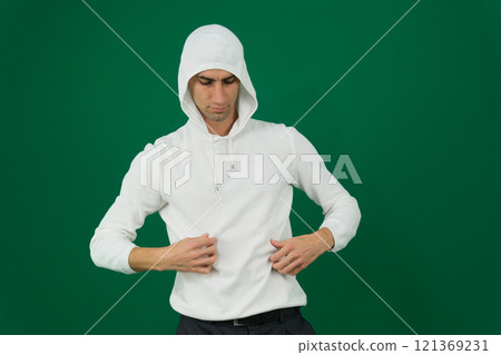 Full length portrait of man in hoodie sweater on light background. Space for design 121369231