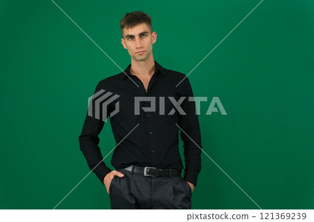 Man wearing black t-shirt on light grey background, closeup. Mockup for design 121369239