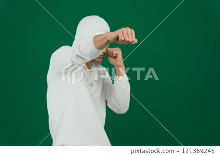 african american man in hoodie fighting on grey 121369245