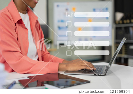 Business performance checklist concept, businessman using tablet and laptop doing online checklist survey, filling out digital form checklist. Business performance checklist concept, businessman using tablet and laptop doing online checklist survey, filling out digital form checklist. 121369504