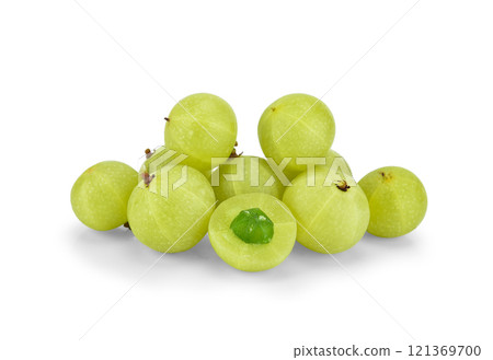 Fresh amla (Indian gooseberry) fruits with cut in half levitate isolated on white background. 121369700