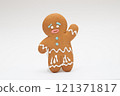 Smiling Christmas gingerbread man standing on white background 121371817