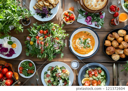 Culinary scenes featuring diverse and inclusive food cultures, including vegan and vegetarian meals, allergy-friendly dishes, and traditional foods from around the world 121372604