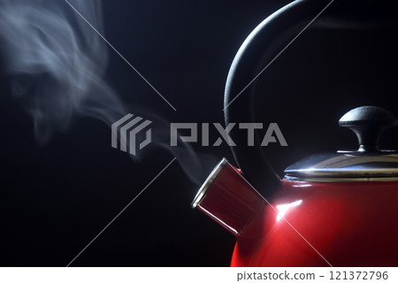 Steam rising from a kettle Steam rising from a kettle 121372796