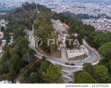 Aerial Drone shot of Church Iglesia de San Cristobalito on the mountain in San Cristobal de Las Casas, Chiapas, Mexico Aerial Drone shot of Church Iglesia de San Cristobalito on the mountain in San Cristobal de Las Casas, Chiapas, Mexico 121373320