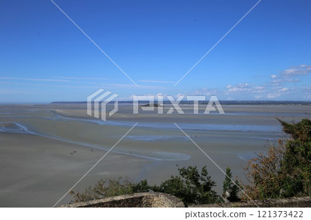 View of the tidal flats from Mont Saint-Michel Abbey at low tide View of the tidal flats from Mont Saint-Michel Abbey at low tide 121373422