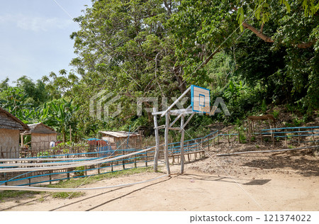 A basketball court in the sand on a small island in the Philippines. A basketball court in the sand on a small island in the Philippines. 121374022