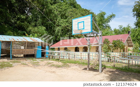A basketball court in the sand on a small island in the Philippines. A basketball court in the sand on a small island in the Philippines. 121374024